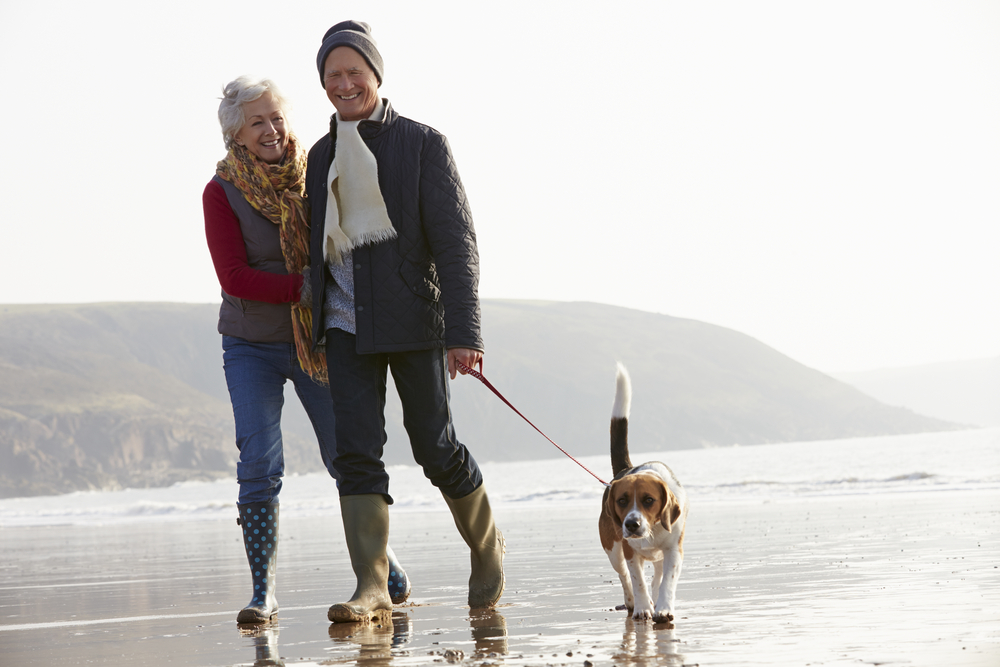 senior_couple_walking_beach_winter_sun_DP